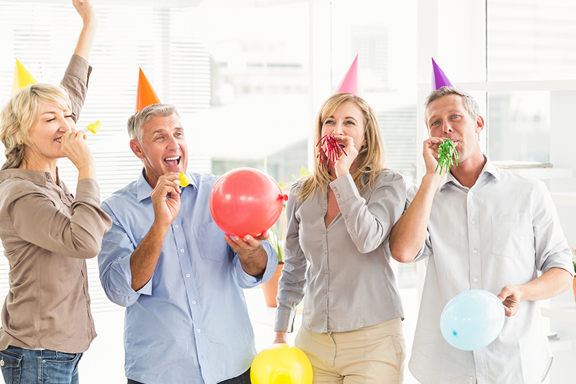 Business people celebrating birthday