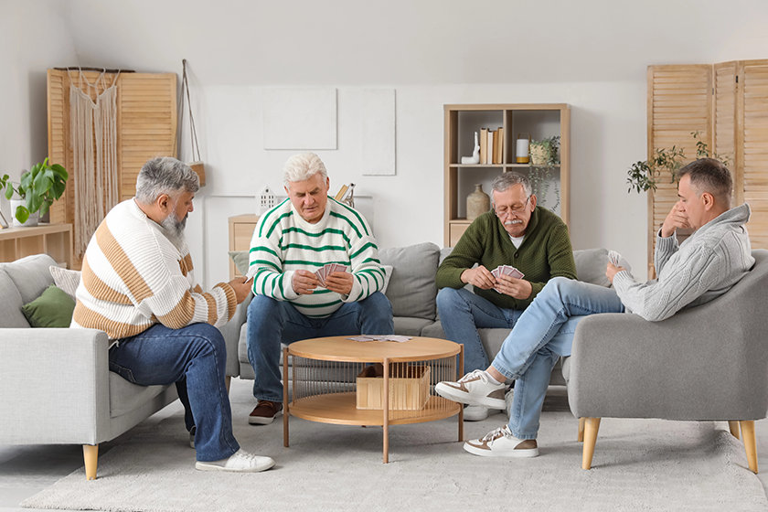 Elderly men playing cards