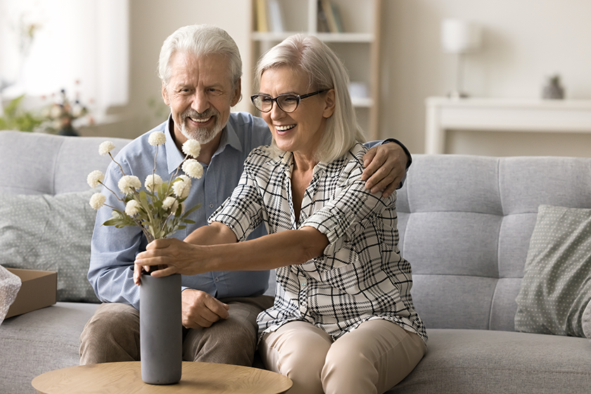 happy-senior-wife-getting-bunch-flowers